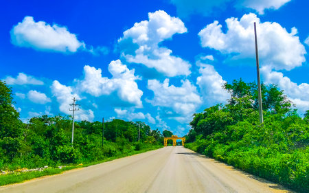 The welcome gate and entrance to the village Kantunilkin in Quintana Roo Mexico.の写真素材