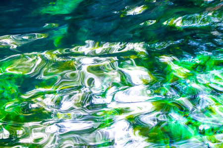 Beautiful Cenote Park Minotauro with limestone rocks turquoise blue green water and nature jungle...