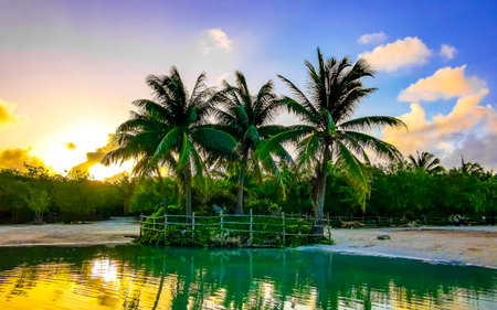 Sunrise at small beautiful Cenote cave with river and turquoise blue water at Punta Esmeralda beach in Playa del Carmen Quintana Roo Mexico.の写真素材