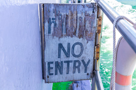 Old weathered wooden do not enter sign in Ao Nang Amphoe Mueang Krabi Thailand in Southeast Asia.