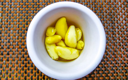 Garlic cloves and bulb on the table in Playa del Carmen Mexico.の写真素材