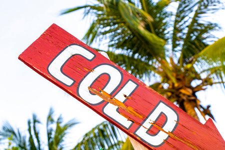 Directional signs on a tropical beach.の写真素材