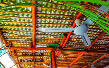 Ceiling fan on the wooden roof and palm leaves in Playa del Carmen Quintana Roo Mexico.の写真素材