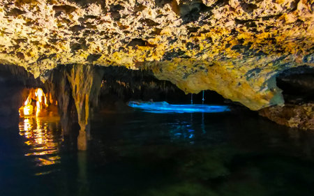 Beautiful Cenote Park Yaxmulito with limestone rocks turquoise blue green water and underground nature jungle in Tulum Quintana Roo Mexico.の写真素材
