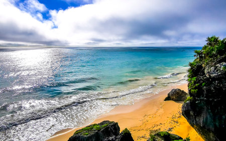Natural seascape coast and beach panorama view at the ancient Tulum ruins Mayan site with temple...