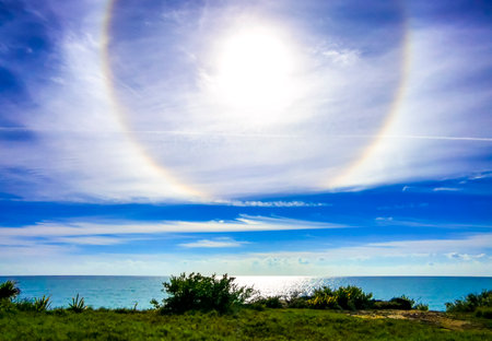 Unreal rainbow circle around the sun in the sky.の写真素材