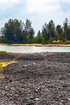 Pakarang Cape tropical paradise beach sea and shore landscape with corals mussels and shells in Khao Lak Amphoe Takua Pa Phang Nga Thailand in Southeast Asia.の写真素材