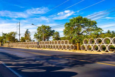 Khao Lak Phang Nga Thailand February 06, 2020 Large sewage cement pipes at the road construction site in Khao Lak Amphoe Takua Pa Phang Nga Thailand in Southeast Asia.の写真素材