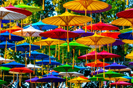Asian tourist street with colorful umbrellas over it in Chiang Mai Amphoe Mueang Chiang Mai Thailand in Southeastasia Asia.の写真素材