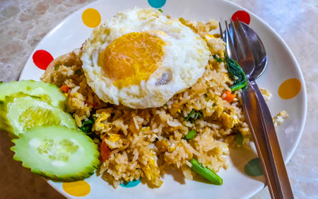 Asian deep stir fried vegetable rice with cucumber and egg in Chiang Mai Amphoe Mueang Chiang Mai Thailand in Southeastasia Asia.の写真素材