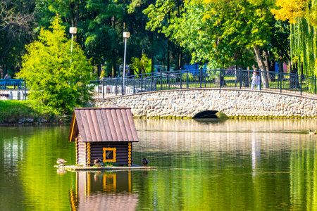 Brest Brest Region Belarus September 20, 2020 Brest City Park green nature landscape with a beautiful river lake pond and bridge in Leninskiy Rayon Brest Brest District Brest Region Belarus.の写真素材