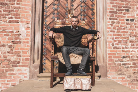 Man on royal armchair in Mir Hrodna Hrodsenskaja Voblasz Belarus.の写真素材
