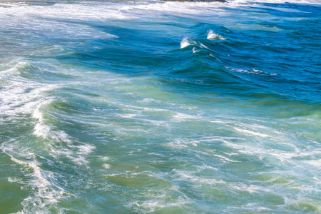 Ipanema Beach Tropical Paradise with Blue Turquoise Water Waves Sea and Boulders Rock Rocks in Rio...