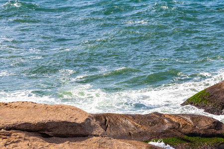 Urca Red Beach Tropical Paradise with Blue Turquoise Water Waves Palm Trees Rocks Hills Cliffs Seascape and White Beach Sand in Rio de Janeiro State of Rio de Janeiro Brazil.の写真素材