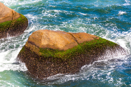 Red Beach Tropical Paradise with Blue Turquoise Water Waves Palm Trees Rocks Hills Cliffs Seascape...