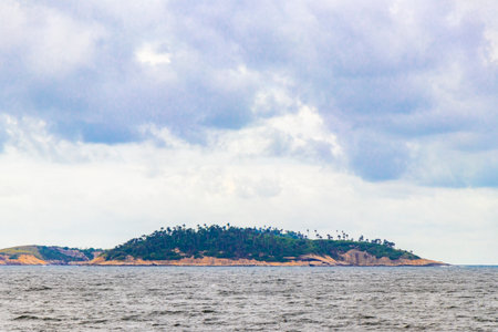 Ipanema Beach Tropical Paradise with Blue Turquoise Water Waves Rocks Hills and Islands in Rio de Janeiro Brazil.の写真素材