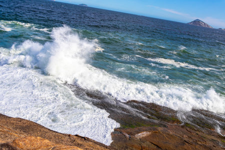 Ipanema Beach Tropical Paradise with Blue Turquoise Water Waves Sea and Boulders Rock Rocks in Rio...