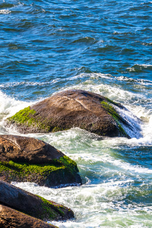 Urca Red Beach Tropical Paradise with Blue Turquoise Water Waves Rocks Hills Cliffs Seascape and...
