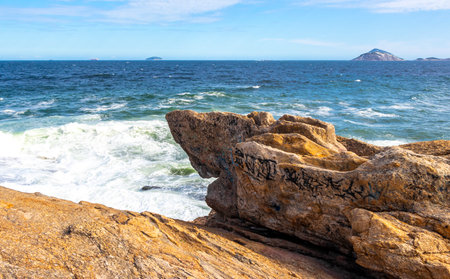 Ipanema Beach Tropical Paradise with Blue Turquoise Water Waves Sea and Boulders Rock Rocks in Rio de Janeiro State of Rio de Janeiro Brazil.の写真素材