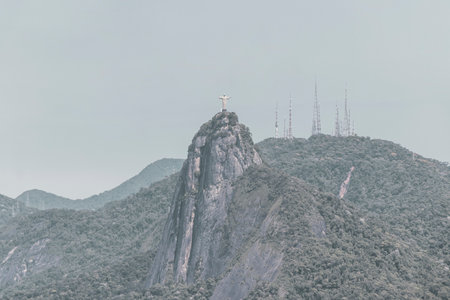Christ the Redeemer Cristo Redentor on Corcovado mountain hill rock tropical forest and blue cloudy sky panorama view of Alto da Boa Vista in Rio de Janeiro Brazil.の写真素材