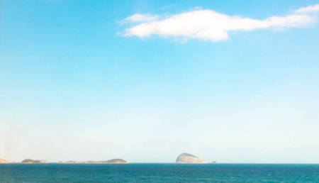 Barra da Tijuca Beach Tropical Paradise with Blue Turquoise Water Waves Rocks Hills and Islands in Rio de Janeiro State of Rio de Janeiro Brazil.の写真素材