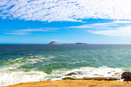 Ipanema Beach Tropical Paradise with Blue Turquoise Water Waves Rocks Hills and Islands in Rio de Janeiro State of Rio de Janeiro Brazil.の写真素材