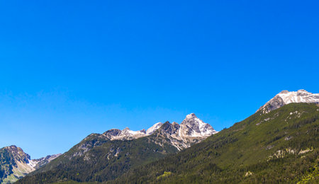Mountain and alpine hill landscape mountains rocks and peaks panorama with snow nature and blue sky...