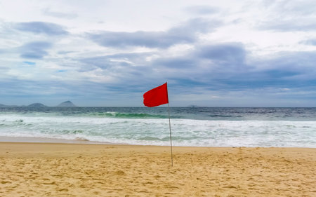 Rio de Janeiro State of Rio de Janeiro Brazil October 24, 2020 Red Flag on Copacabana Beach Tropical...