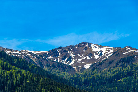 Mountain and alpine hill landscape mountains rocks and peaks panorama of Lechtal alps with snow nature and blue sky in the Alps Fliess Landeck Tyrol Austria.の写真素材