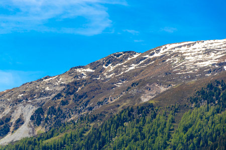 Mountain and alpine hill landscape mountains rocks and peaks panorama of Lechtal alps with snow nature and blue sky in the Alps Fliess Landeck Tyrol Austria.の写真素材