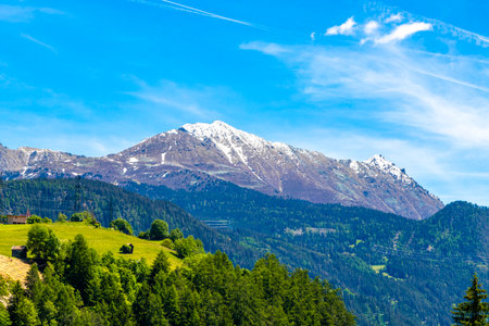 Mountain and alpine hill landscape mountains rocks and peaks panorama of Lechtal alps with snow nature and blue sky in the Alps Fliess Landeck Tyrol Austria.の写真素材