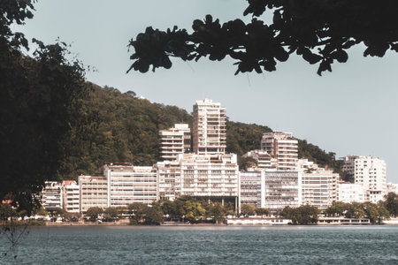 Barra da Tijuca Beach Tropical Paradise with Promenade Blue Hills Mountains Water Palm Trees and City Skyline in Rio de Janeiro State of Rio de Janeiro Brazil.の写真素材