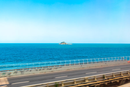 Barra da Tijuca Beach Tropical Paradise with Blue Turquoise Water Waves Rocks Hills and Islands in Rio de Janeiro State of Rio de Janeiro Brazil.の写真素材