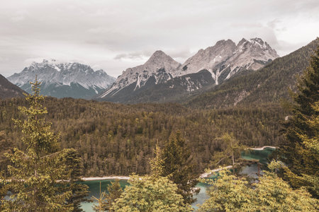 Panoramic view of Germanys largest mountain Zugspitze alpine landscape with turquoise Blindsee lake forest rocks hills and mountains in the Alps Biberwier Reutte Tyrol Austria.の写真素材