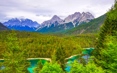 Panoramic view of Germanys largest mountain Zugspitze alpine landscape with turquoise Blindsee lake forest rocks hills and mountains in the Alps Biberwier Reutte Tyrol Austria.の写真素材