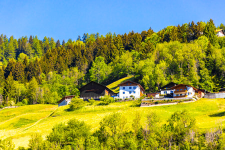 Mountain and alpine hill landscape mountains rocks and peaks panorama with green fields meadows...