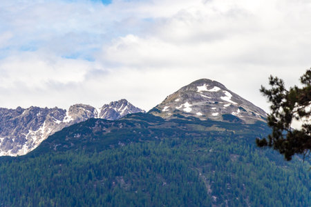 Panoramic view of Marienberg mountain at Zugspitze alpine landscape with green forest rocks hills and mountains in the Alps Biberwier Reutte Tyrol Austria.の写真素材