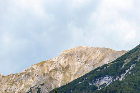 Panoramic view of Marienberg mountain at Zugspitze alpine landscape with green forest rocks hills and mountains in the Alps Biberwier Reutte Tyrol Austria.の写真素材