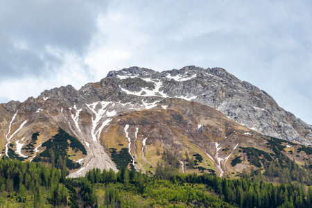 Panoramic view of Marienberg mountain at Zugspitze alpine landscape with green forest rocks hills and mountains in the Alps Biberwier Reutte Tyrol Austria.の写真素材