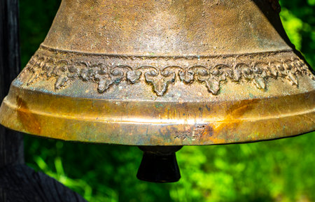 Landeck Tyrol Austria May 30, 2025 Ringing the Christian bell on the wooden house in the Alps Fliess Tyrol Austria.の写真素材