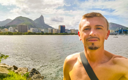 Tourist traveler handsome man takes selfie at the Botafogo Flamengo and the Urca village in Rio de...