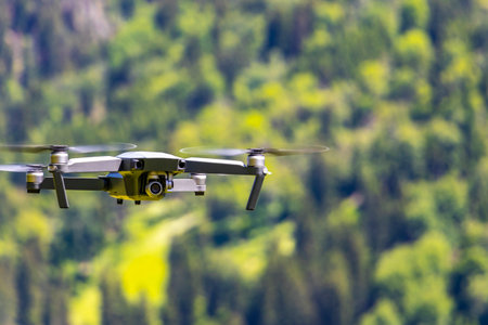 Landeck Tyrol Austria May 30, 2025 Drone flies in the air with mountain and forest scenery in the Alps Fliess Landeck Tyrol Austria.の写真素材