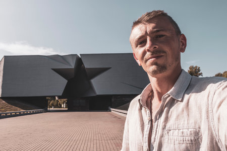 Man handsome tourist at the Brest Fortress star gate Brestskaya Krepost Zvezda in Leninskiy Rayon...