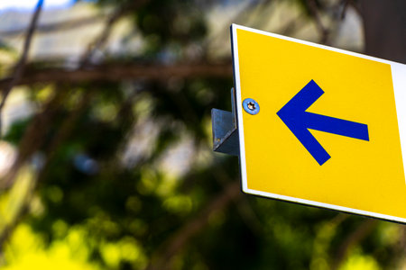 Reutte Tyrol Austria May 30, 2025 Yellow road sign with location information direction and arrow in...