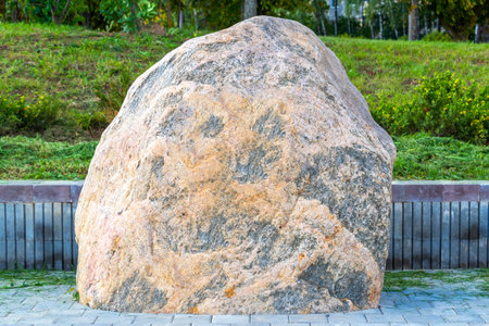 Minsk District Minsk Region Belarus September 10, 2020 with walking path field in green nature forest trees and big rock monument statue sculpture in Minsk Belarus.の写真素材