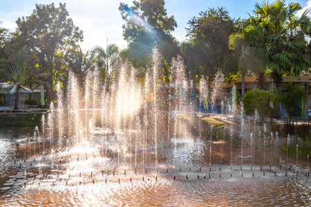 Ton Tann Green Market Thai night street food park with beautiful fountain fountains and pond water in Khon Kaen District Khon Kaen Province Isan Northeast Thailand.の写真素材