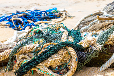 Ropes and fishing nets lie on the sand on a tropical beach in Patong Beach Kathu District Phuket...