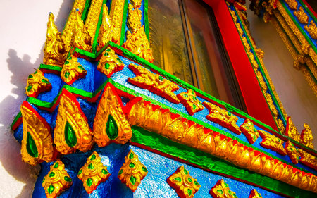 Kathu District Phuket Island Province Thailand October 26, 2025 Suwankeereewong Temple golden colorful Buddhist window architecture details in Patong Beach Phuket Island Southern Thailand.の写真素材