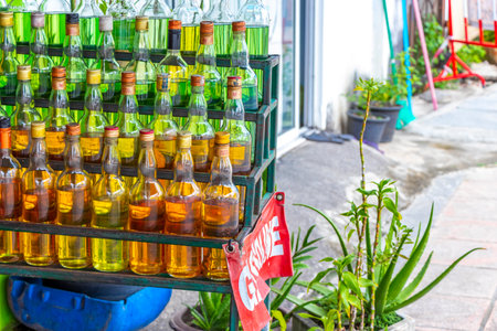 Kathu District Phuket Island Province Thailand October 17, 2025 Scooter filling station with gasoline in glass bottles in Patong Beach Kathu District Phuket Island Thailand in Southeast Asia.の写真素材
