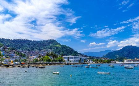 Angra dos Reis State of Rio de Janeiro Brazil October 27, 2020 Panorama of tropical coast beach seascape with turquoise green blue water pier port harbor with ships yachts and boats.の写真素材